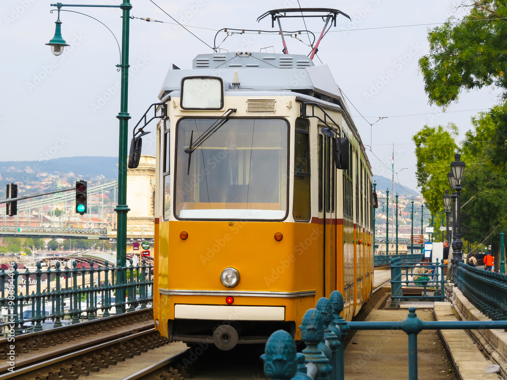 Historic yellow tram on the street, Budapest