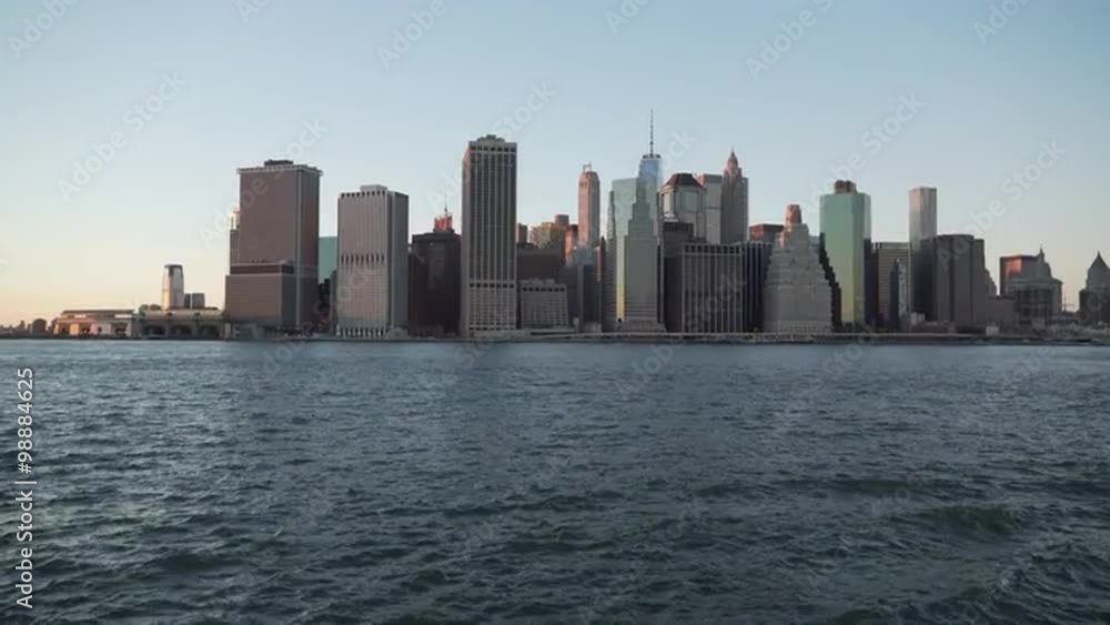 New York City skyline from the harbor in the soft light of early evening. New York City skyline from the harbor in the soft light of early evening.