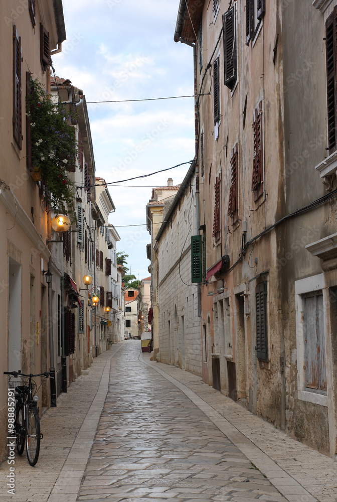 Old town street with stores in Porec  in Croatia
