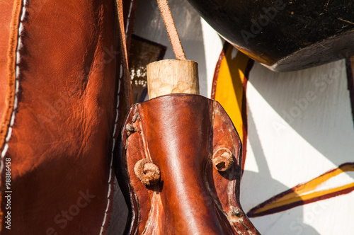 historical reconstruction of ancient leather flask on holiday photo