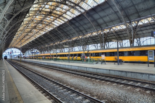 Main railway station in the Prague. Yellow train in background. © Radoslaw Maciejewski