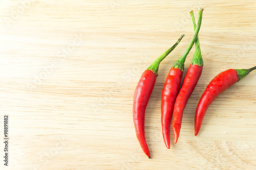red chilli on wood background