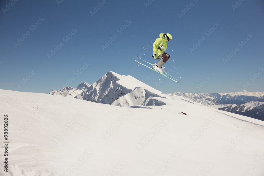 Flying skier on mountains. Extreme sport. Flying skier on mountains. Extreme sport.