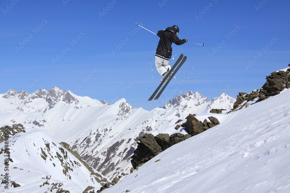 Flying skier on mountains. Extreme sport. Flying skier on mountains. Extreme sport.