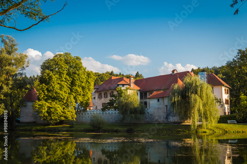 Otocec, Slovenia - September 12, 2015. Otocec castle view from the bank of the Krka river.