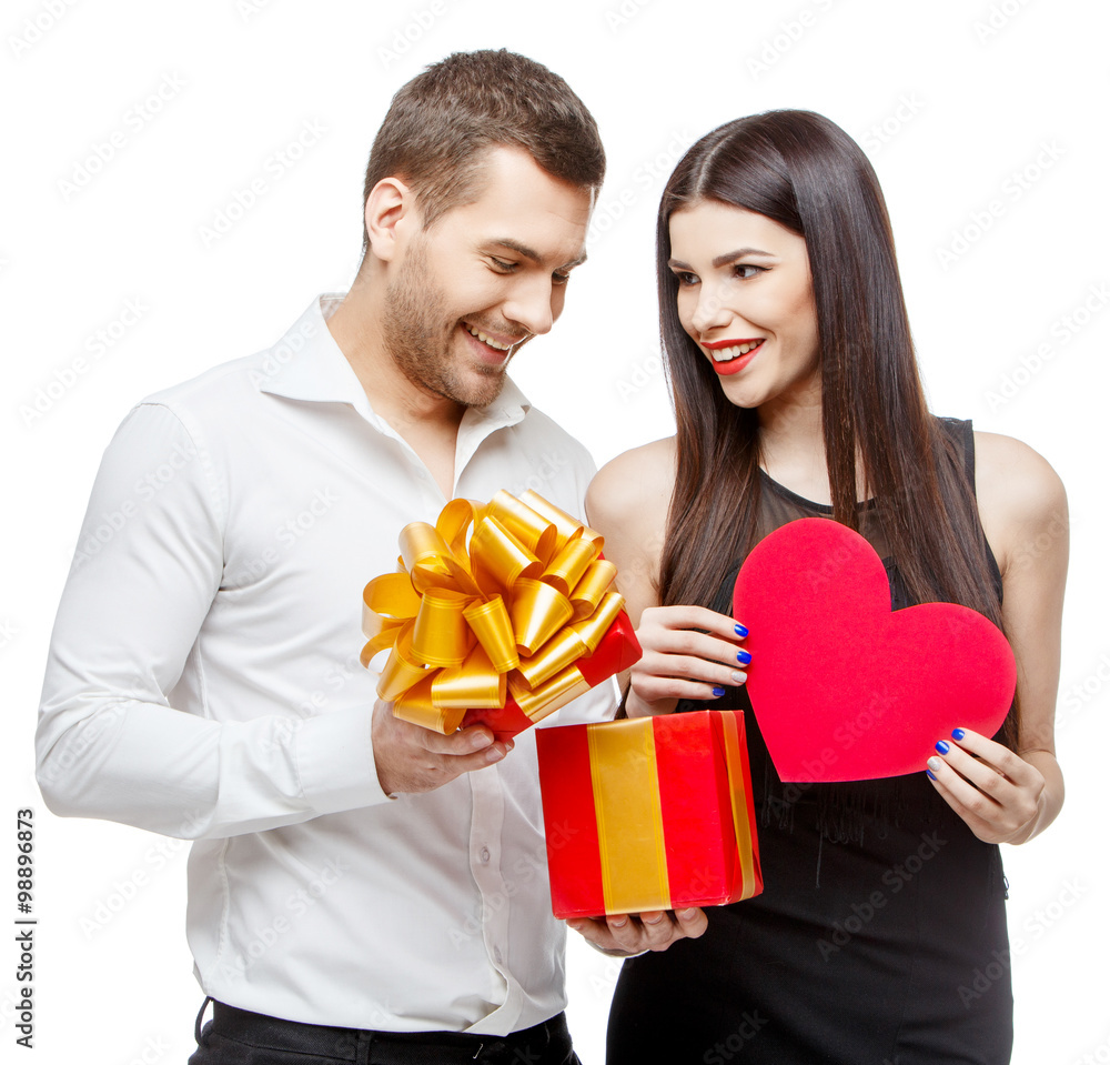 Young beautiful couple with present isolated on white Young beautiful couple with present isolated on white