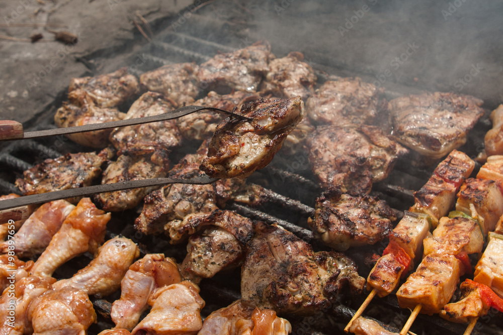 man hand put bbq meat on grill man hand put bbq meat on grill