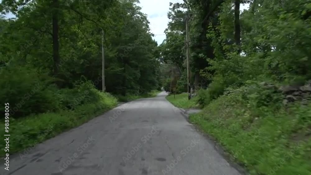 Driving along a New England country road Driving along a New England country road
