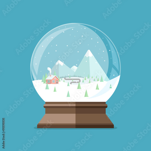 Christmas snow globe with house in the forest and mountains insi photo
