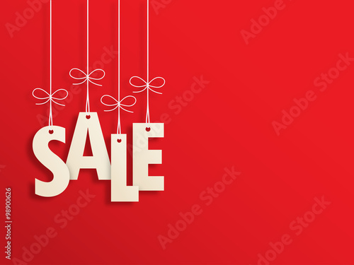Suspended SALE letters on red background photo