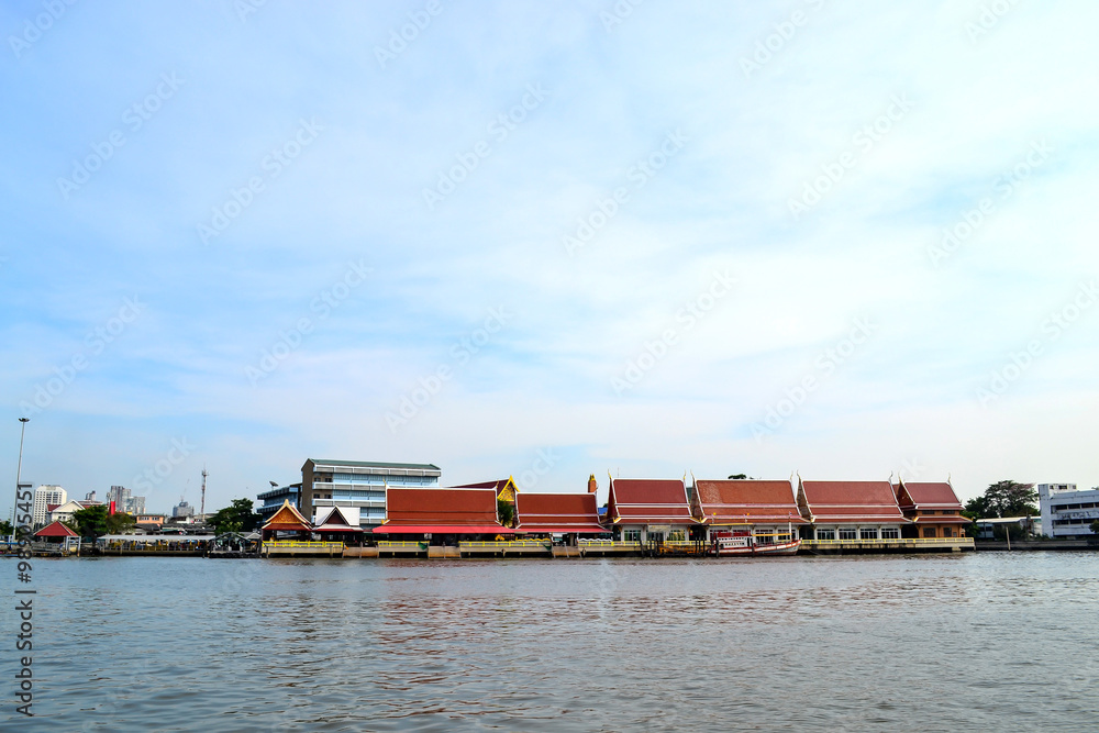 Temple riverside Chao Phraya River with blue sky