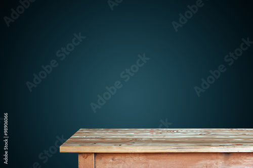 Wallpaper Mural Empty wooden table against a blue wall. Torontodigital.ca