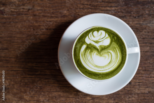 matcha green tea latte on wooden background