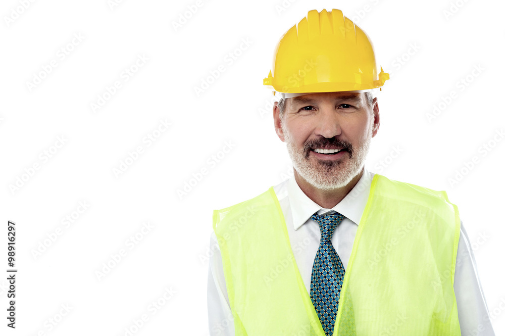 Confident senior architect with jacket and hard hat Confident senior architect with jacket and hard hat