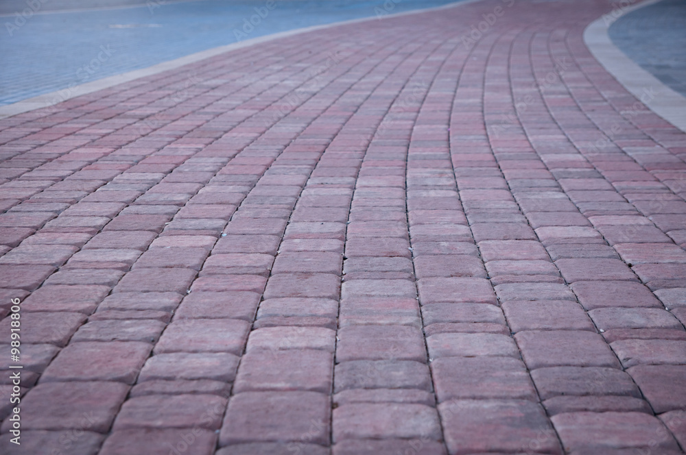 Pedestrian sidewalk at the empty street.