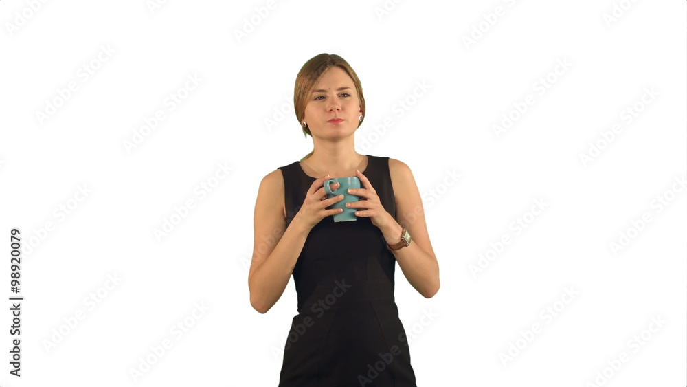 Young beautiful woman holding cup of tea or coffee on white background isolated Young beautiful woman holding cup of tea or coffee on white background isolated