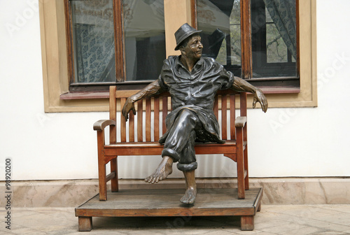 Photography PRAGUE, CZECH REPUBLIC - APRIL 16, 2010: Sculptural composition with a man sitti