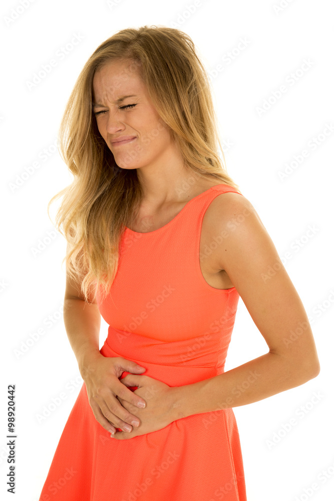 woman stand in red dress sick hold stomach woman stand in red dress sick hold stomach