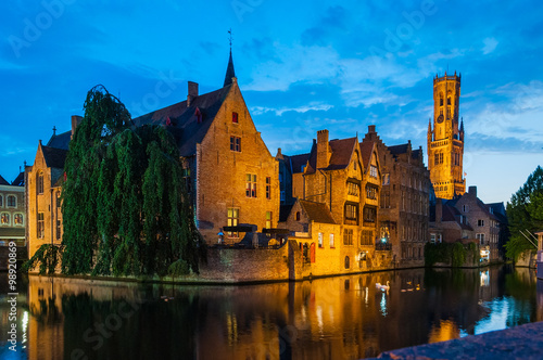 Night scene of Rozenhoedkaai and Belfort Tower in Brugge Belgium