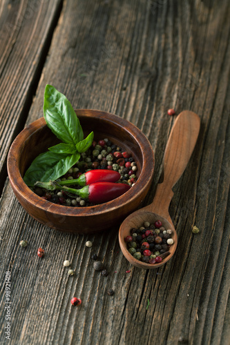 Pepper mix on the wooden background