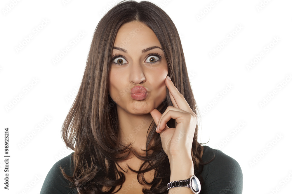 beautiful young woman with pursed lips Stock Photo Adobe Stock