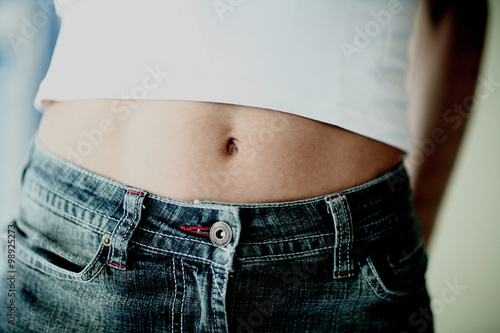 Sexy slim woman's flat stomach photo