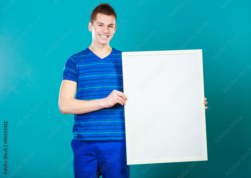 man holding blank presentation board on blue man holding blank presentation board on blue