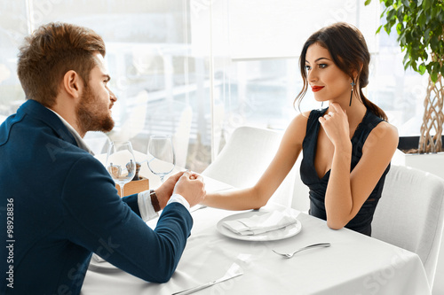 Couple In Love Celebrating. Romantic Dinner In Restaurant. Romance, Relationships.