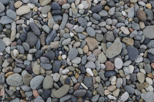 Pebbles and pea gravel, suitable for use as a background or texture