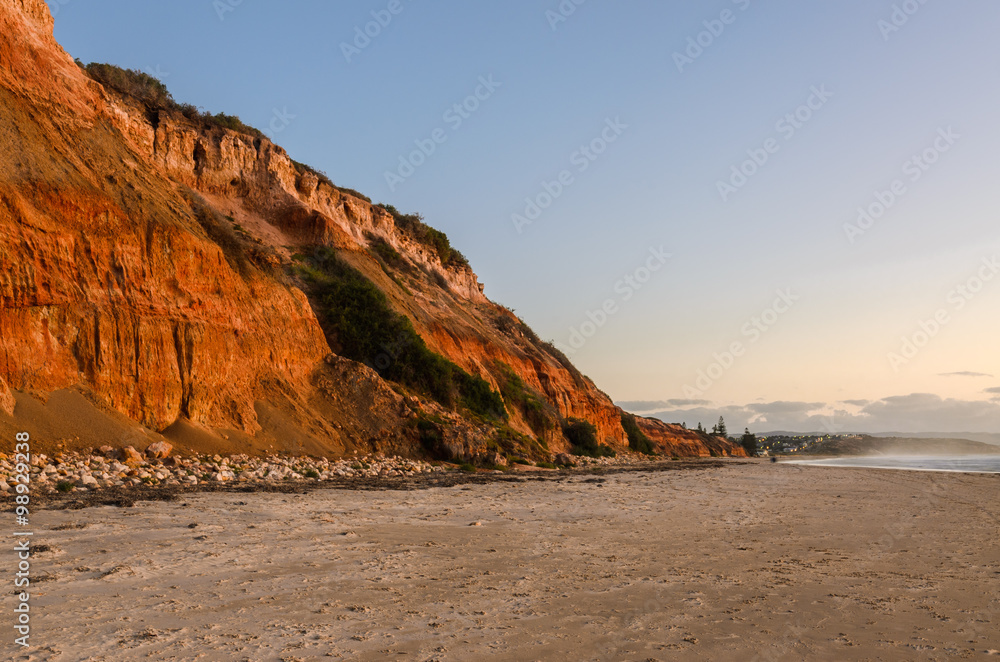 Cliffs coast line sand beach landscape at sunset Cliffs coast line sand beach landscape at sunset