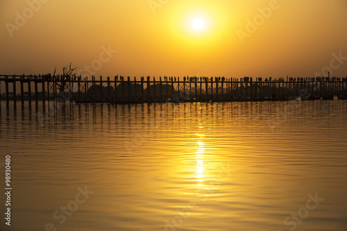 Silhouetted people on U Bein Bridge at sunset, Amarapura, Mandal