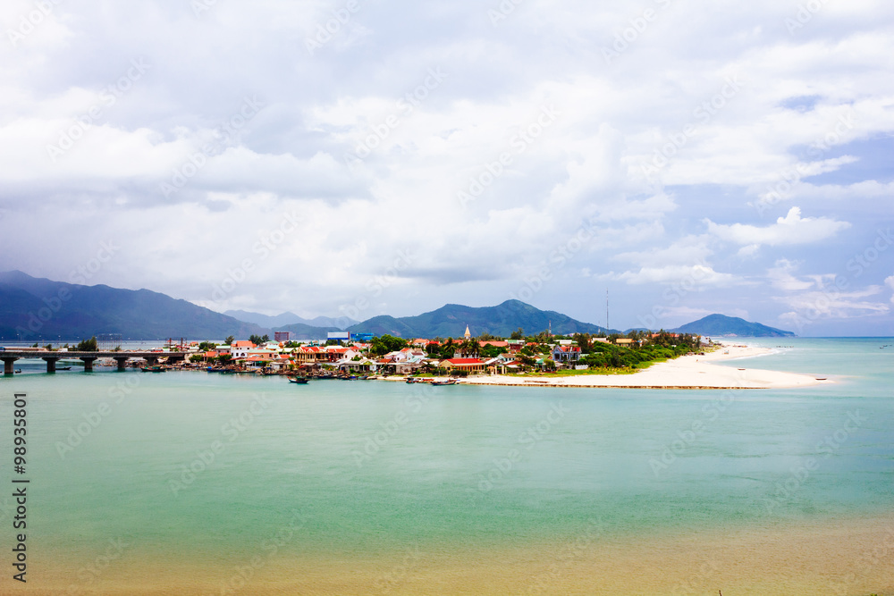 Lang Co beach, Hue province, Viet Nam. Lang Co is an attractive island-like stretch of palm-shaded white sand, with a turquoise lagoon on one side and 10km of beachfront on the other.