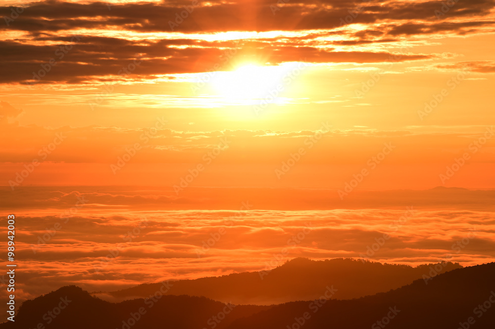 Beautiful sunset at the mountains. Colorful landscape with sun and