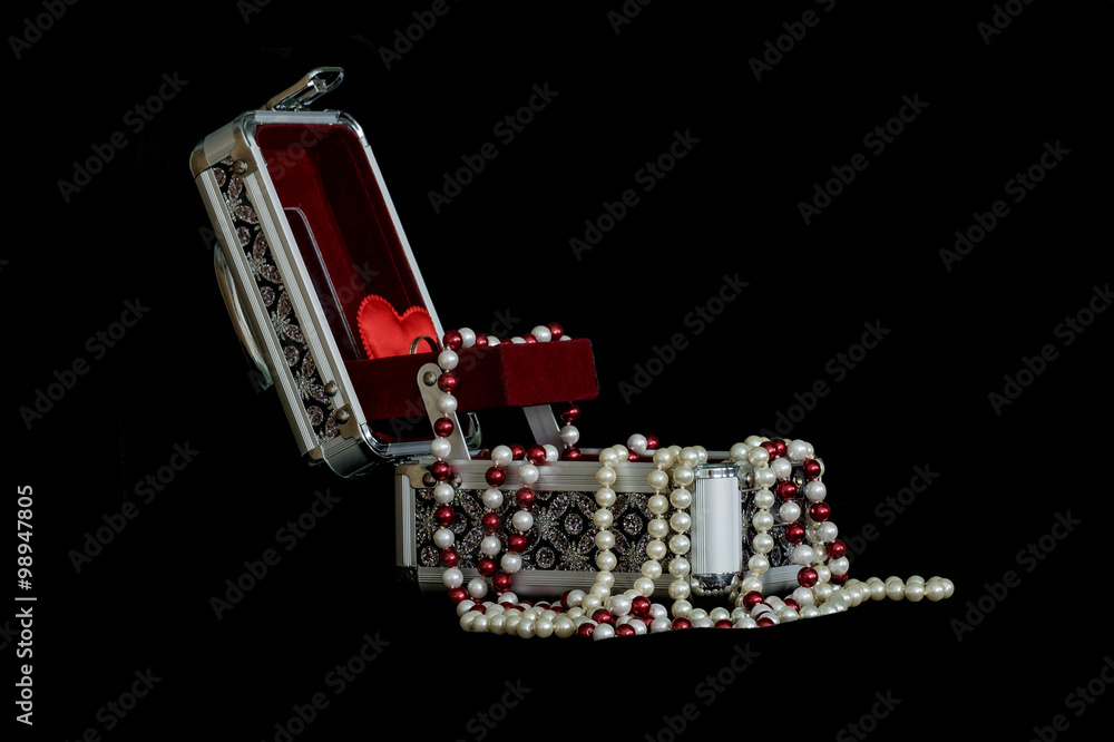Box for jewelry and necklace isolated on a black background. Box for jewelry and necklace isolated on a black background.