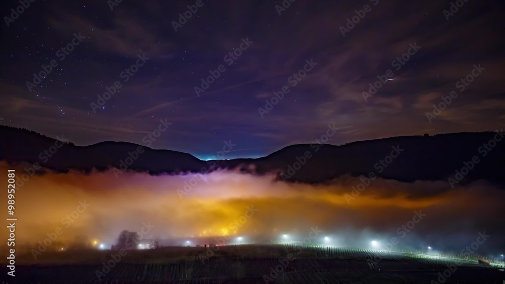 Foggy Winternight over a Town Timelapse UHD