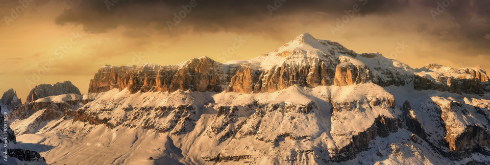 Fantastic winter landscape. Dramatic overcast sky, Italian Alps