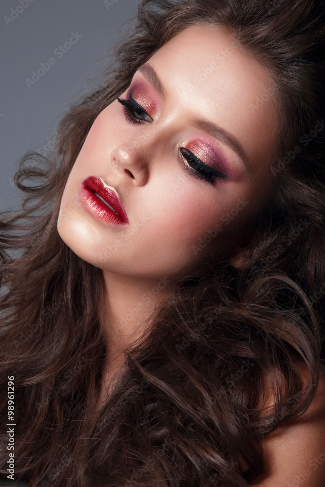 Portrait of a young woman, close-up, bright makeup, eye shadow.