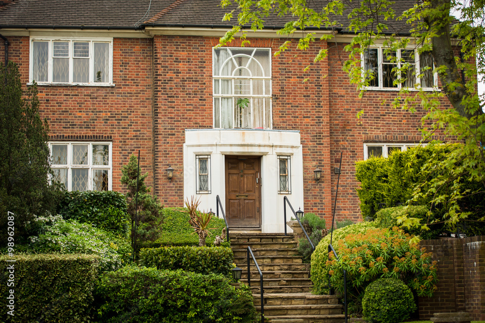 Beautiful home with a lot of green outside.