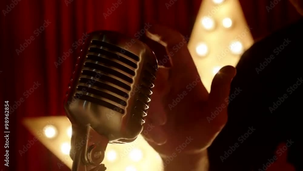 Man Tapping the Microphone to Check It