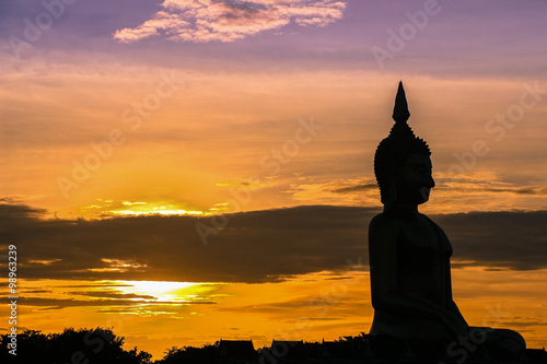 The shadow of seated buddha in evening sunset