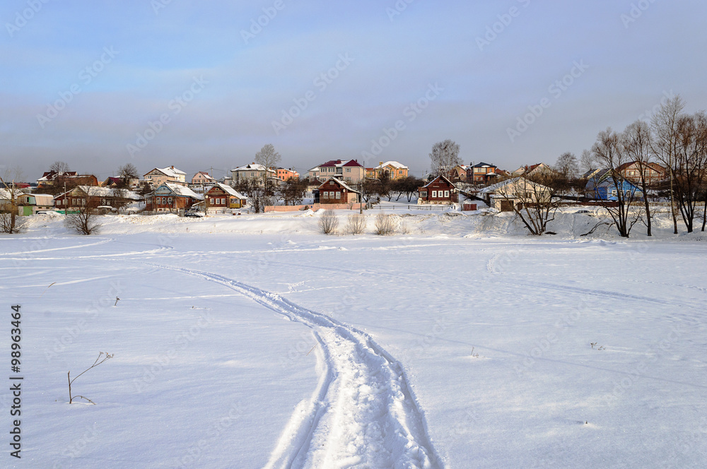 Winter country landscape with snow over lake