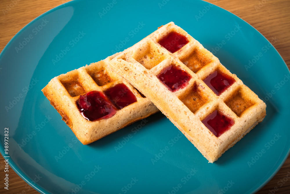 Traditional belgium soft fresh waffles with a decor on a plate. Traditional belgium soft fresh waffles with a decor on a plate.