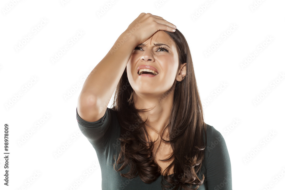frustrated young woman on a white background frustrated young woman on a white background
