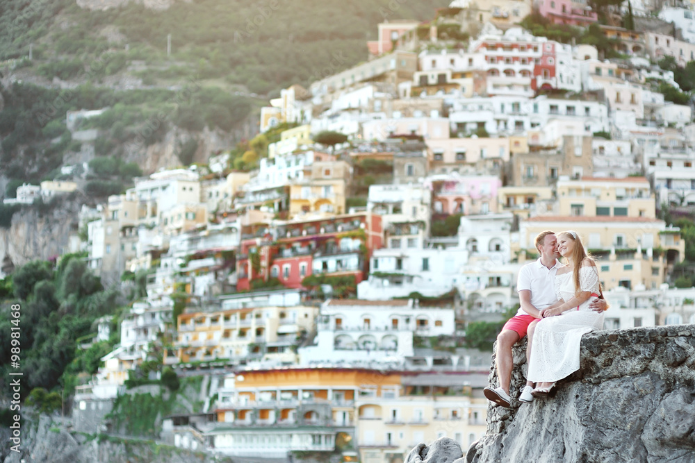 young couple tenderly together in honeymoon in Positano, Amalfi coast, Italy