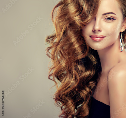 Fotografie Beautiful girl with long wavy hair