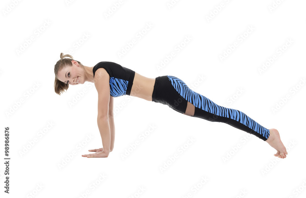Studio image of pretty smiling girl doing push-ups Studio image of pretty smiling girl doing push-ups