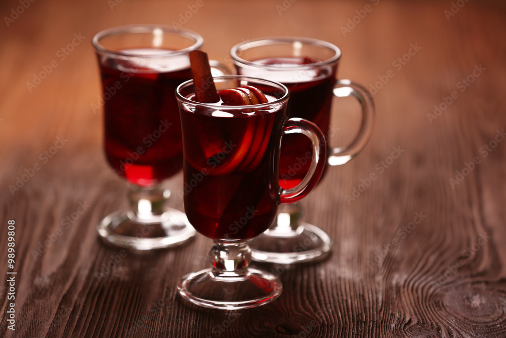Mulled wine on wooden table Mulled wine on wooden table