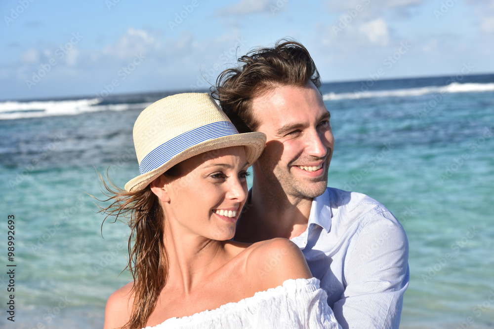 Portrait of cheerful couple on vacation in Caribbean island Portrait of cheerful couple on vacation in Caribbean island