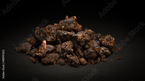 Fotografie, Obraz Pile of Organic Indian bdellium or Guggul resin (Commiphora wightii) on dark background