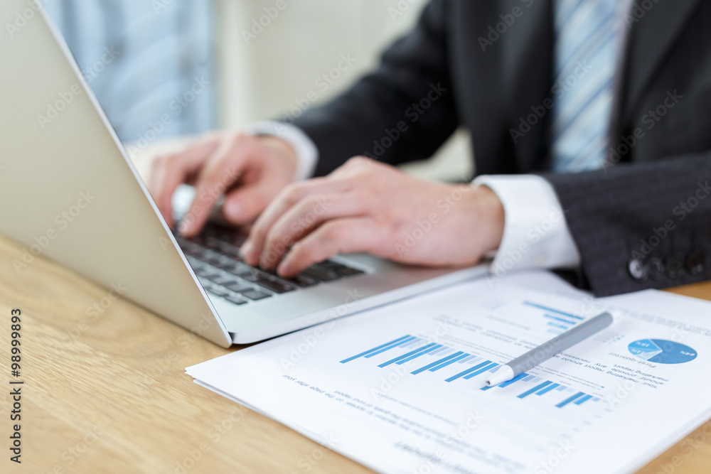 businessman checking financial reports on table businessman checking financial reports on table